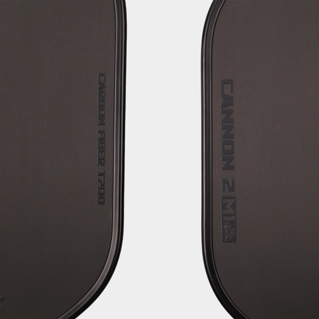 Luzz Cannon2 M1 pickleball paddle - surface macro showing the T700 carbon fibre and Cannon 2 M1 markings