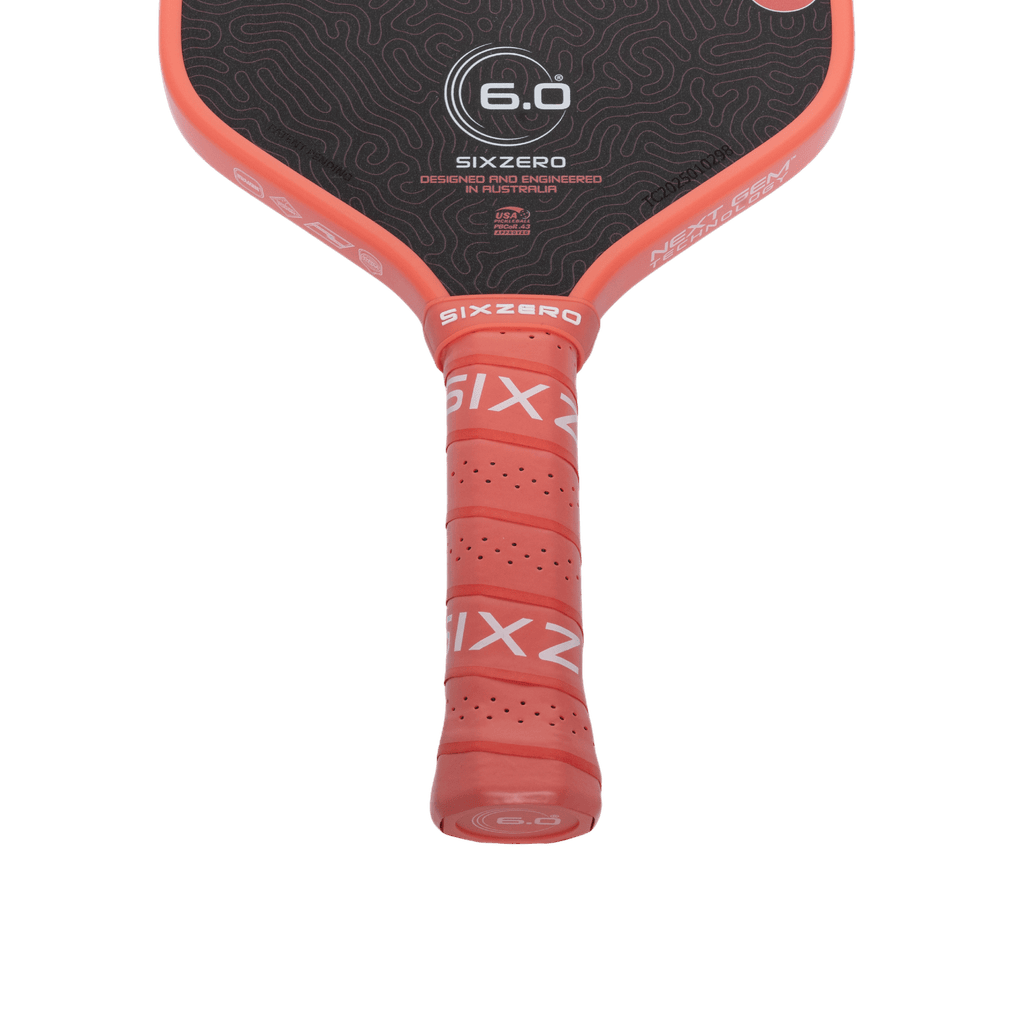 Six Zero Coral 16mm Hybrid Coral Pink pickleball paddle, handle and grip detail