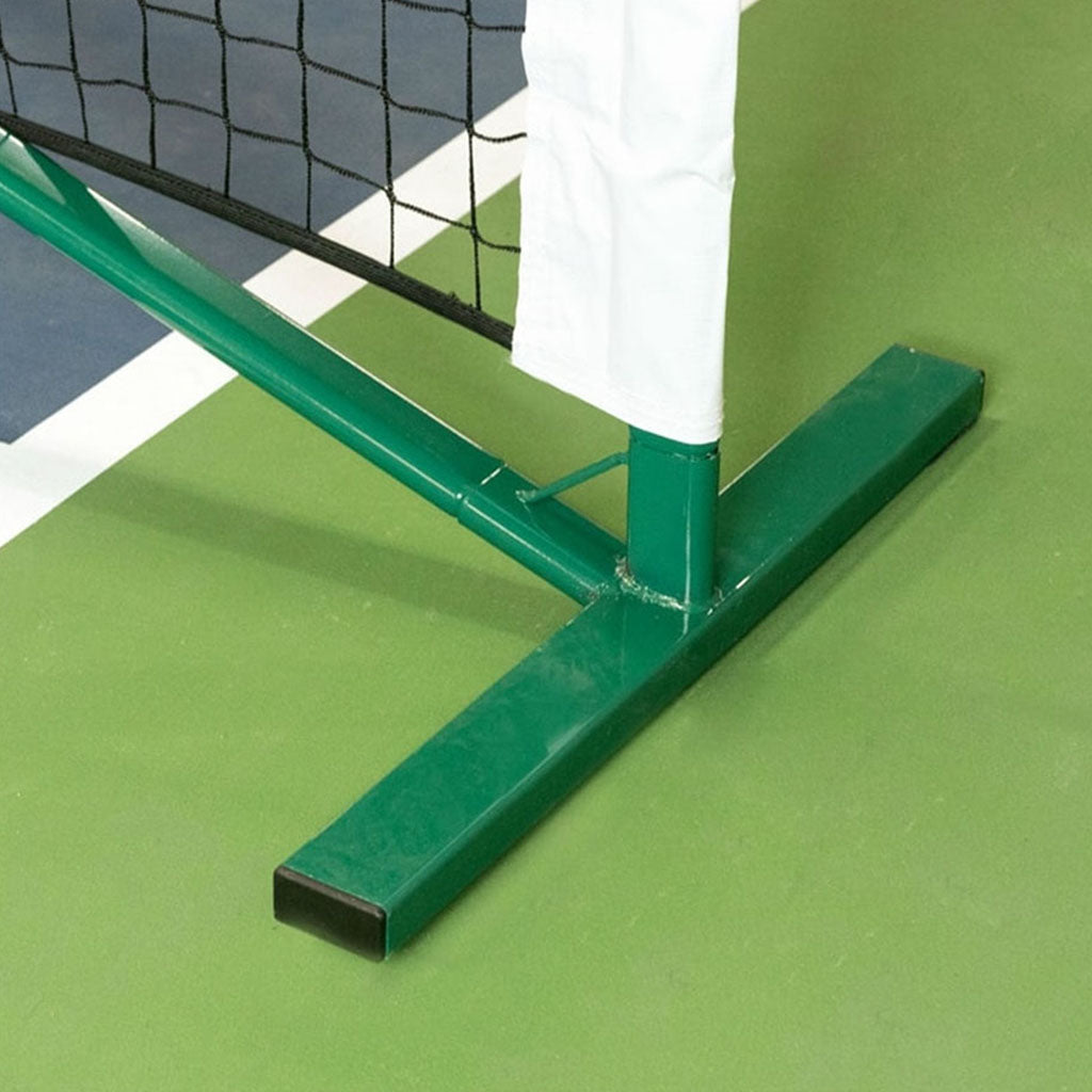Close up of the PickleNet green oval pole seated in its T shaped base, the patented oval tube that stops the frame twisting