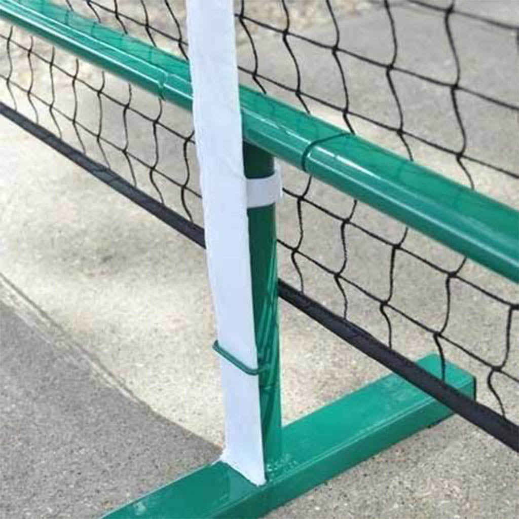PickleNet centre support with the white rectangular centre strap holding the net at regulation 34 inch height