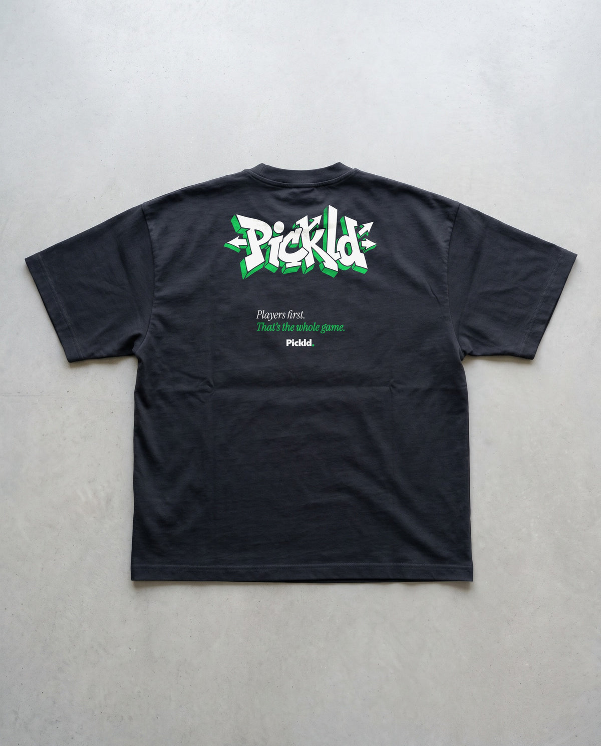 Pickld Wild Style tee, back print, on a black AS Colour Block Oversized Tee