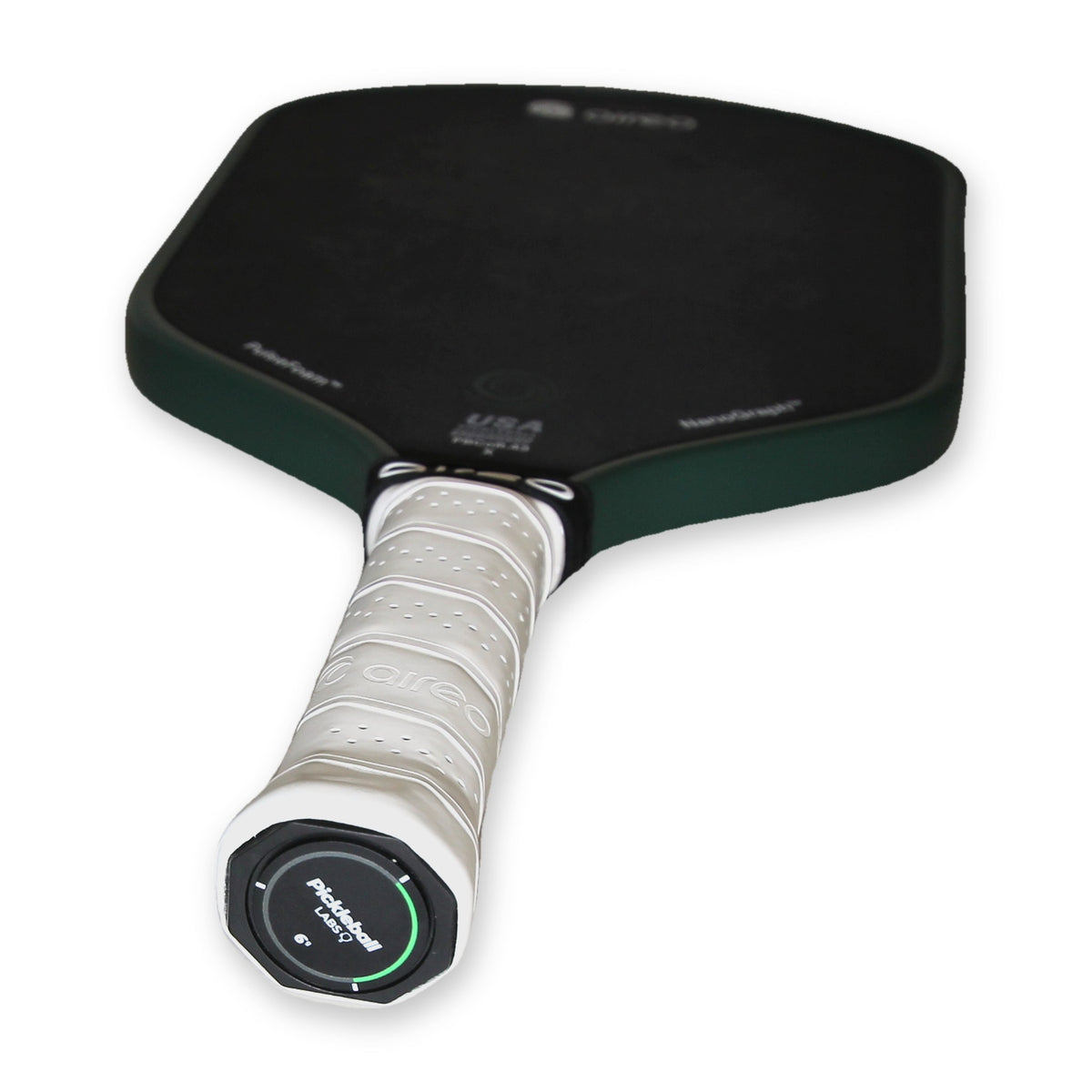 Pickleball Labs Balance Cap fitted to the end of a pickleball paddle handle